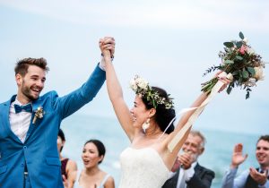 Young couple in a wedding ceremony at the beach